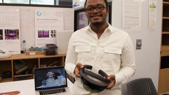 Levi Mollison ('17 B.S Integrated Digital Media) with his project, part of the Microsoft HoloLens Design Challenge.
