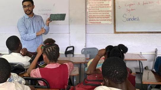 Student teaching Jamaican school children