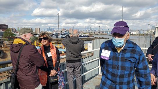 Group of alumni standing overlooking the Brooklyn Navy Yard