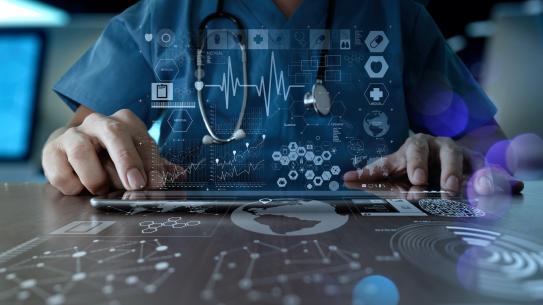 doctor touching tablet with health data superimposed