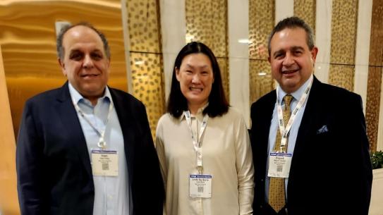 Woman between Two Men Group Photo