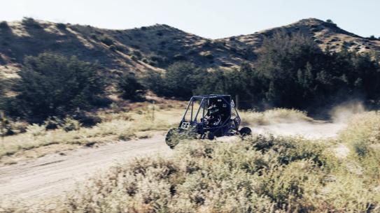 Baja car in competition on dirt track