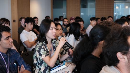 People listen to a speech