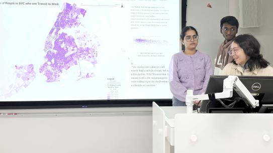 Milka Vincentiya, Lochan Pranav M, and Vaishnavi Potphode in front of a map of NYC.