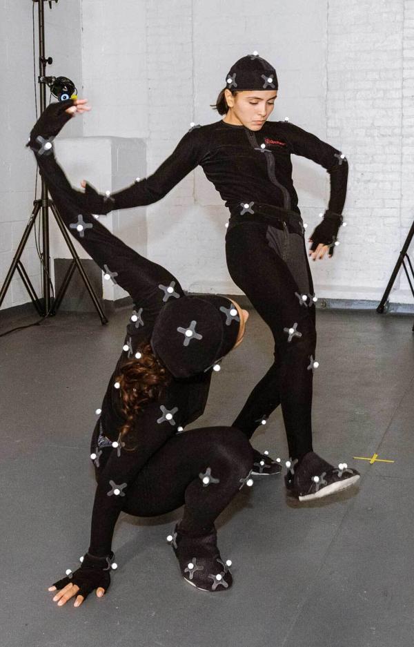 students wearing motion capture bodysuits