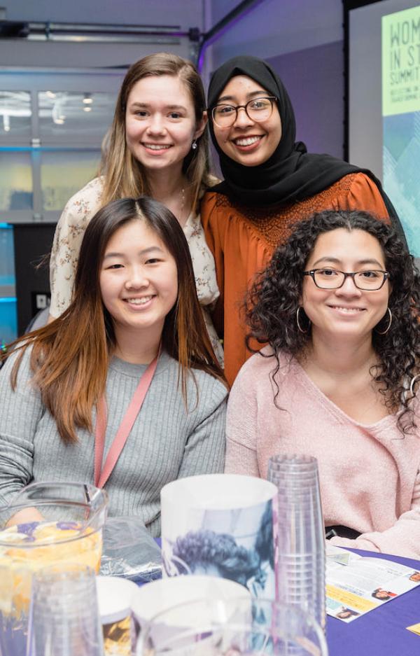 4 diverse female students at women in STEM summit