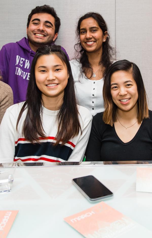 4 smiling students of asian heritage