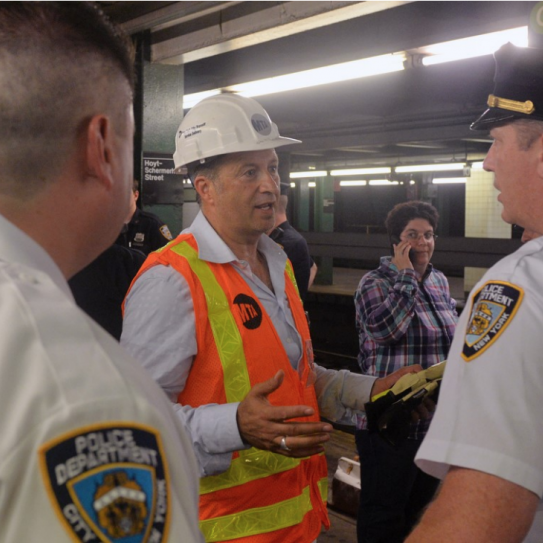 Tony Abdallah coordinating activities with NYPD following a G train derailment.