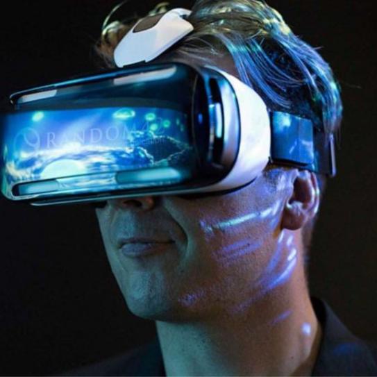 a person wearing VR equipment that is shining in blue