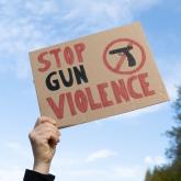 Stock image of a sign stating stop gun violence