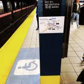 A wheelchair accessible pathway map in a NYC subway station