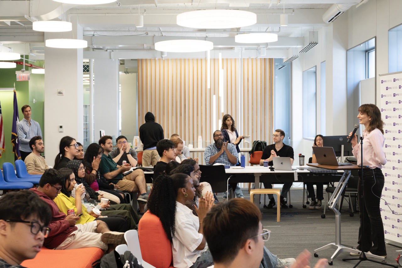 a faculty fellow presenting their research to a group of students