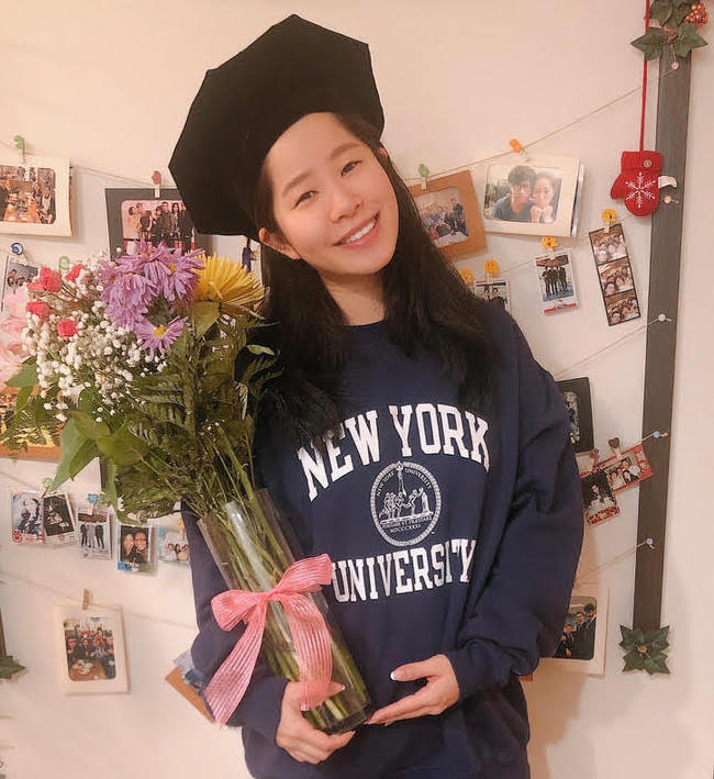 Yao Wang in her cap and NYU sweatshirt