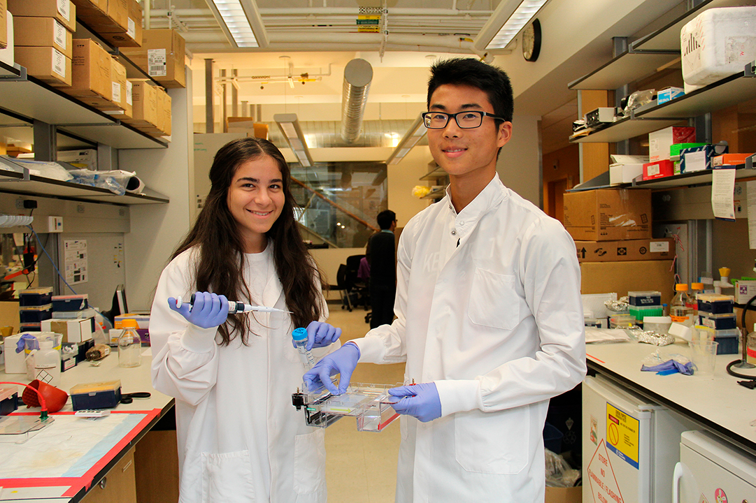students holding up samples in a lab