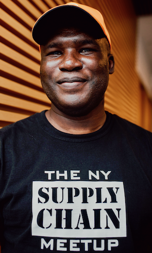 Brian Aoaeh wearing a NY Supply Chain Meetup t-shirt