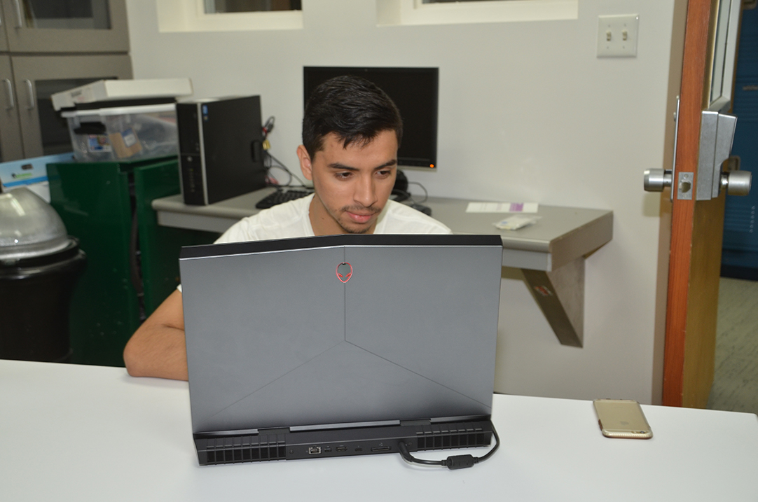 student working at a laptop