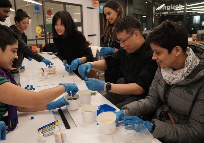 people wearing gloves testing water samples