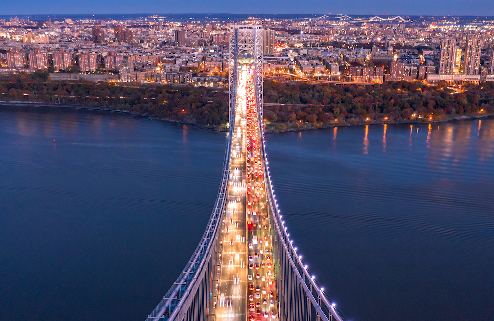 bridge with traffic on it at night
