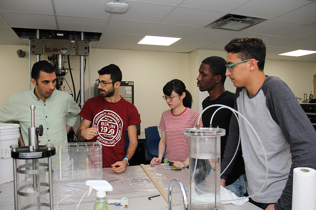 students conducting experiments in a lab 